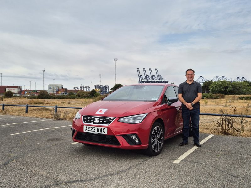 Anthony Dadswell standing beside the Drive Suffolk SEAT Ibiza