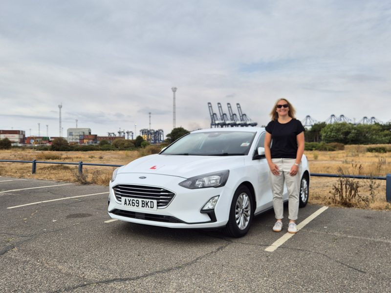 Jane Erskine standing beside the Drive Suffolk Ford Focus