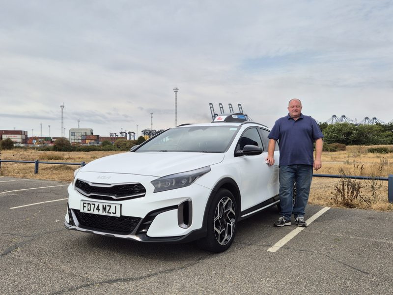Tony Duke standing beside the Drive Suffolk Kia Xceed